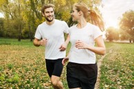 21 Oct 2012 --- Couple jogging in park --- Image by © Tomas Rodriguez/Corbis
